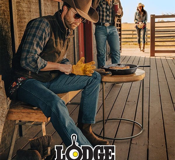 Rustic scene of a man in a cowboy hat grilling on a wooden deck, with two women in the background, captured by Nathalie DuPré Photography. Authentic outdoor moments in Chattanooga, TN by teensee photographer Nathalie DuPre.